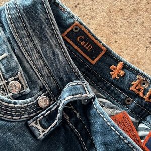 Gently worn rock revival jeans.